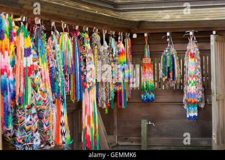 Japanese handmade 1000 paper cranes hanged over the Shrine's wall Stock Photo