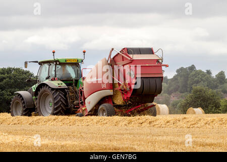 Deutz-Fahr tractor and Lely  Welger RP435 Baler working near Ecton, Northamptonshire. Stock Photo