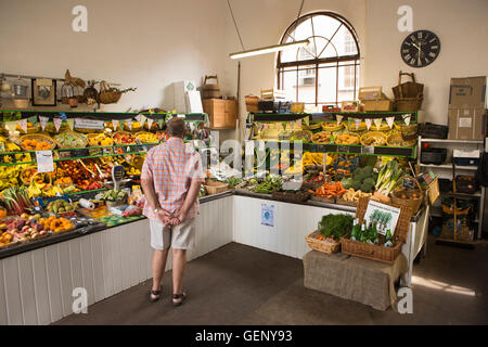 UK, England, Devon, Sidmouth, Old Fore Street, Market Square, Sidmouth Market interior, fruit and veg stall Stock Photo