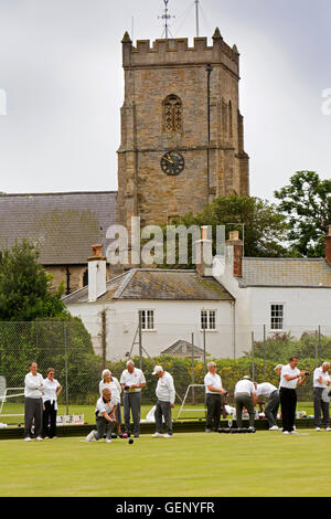 UK, England, Devon, Sidmouth, Coburg Pleasure Grounds bowls players below Church tower Stock Photo