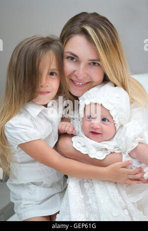 mom with three beautiful daughters posing for the camera Stock Photo