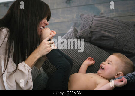 A woman playing with her young son. Stock Photo