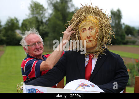 Local businessman Martin Lawlor adjusts his scarecrow titled Trump Card of US Presidential candidate Donald Trump at the Durrow Scarecrow Festival, which takes place annually in Durrow, Co. Laois, Ireland. Stock Photo
