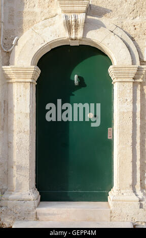 Wooden door at Polignano a mare in Puglia, Italy Stock Photo