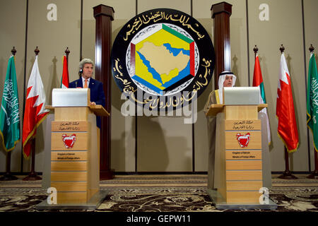 Secretary Kerry Listens as Saudi Arabian Foreign Minister al-Jubeir Addresses Reporters After a Gulf Cooperation Council Ministerial Meeting in Manama Stock Photo