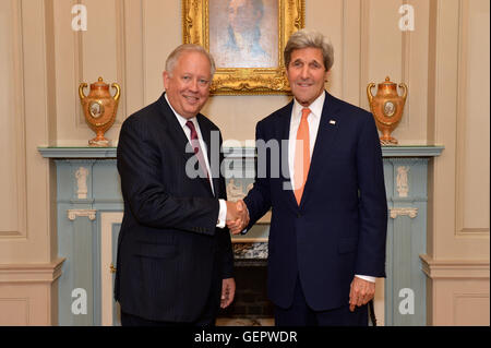 Secretary Kerry Poses for a Photo With Ambassador Shannon Before Swearing Him in as the New Under Secretary of State for Political Affairs Stock Photo