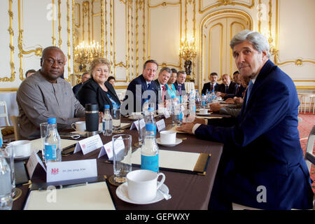 Secretary Kerry Sits With British Prime Minister David Cameron and Other International Government Officials at Lancaster House Stock Photo