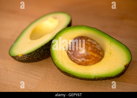 An avocado cut in half. Stock Photo