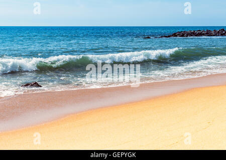 Soft wave of the sea on the sandy beach Stock Photo