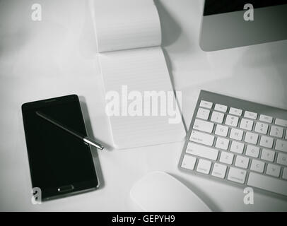 Office table with smart phone, computer and organizer and computer mouse. keyboard Stock Photo