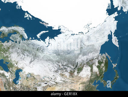 Satellite view of Russia and Central Asia in winter, with partial snow cover and Arctic ice cap (with country boundaries). This image was compiled from data acquired by Landsat 7 & 8 satellites. Stock Photo