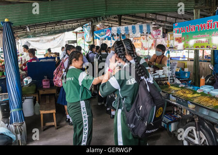 School kids in local street food market,Chiang Mai Thailand Stock Photo