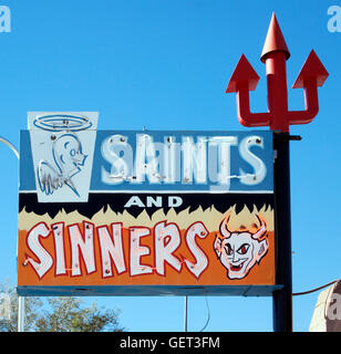 Saints and Sinners sign at a liquor store in Espanola New Mexico Stock Photo