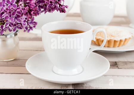 Composition of white porcelain cup of tea Stock Photo