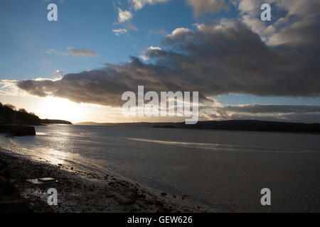 Cloud passing over The River Kent at Arnside with a view toward Grange Over Sands Cumbria England Stock Photo