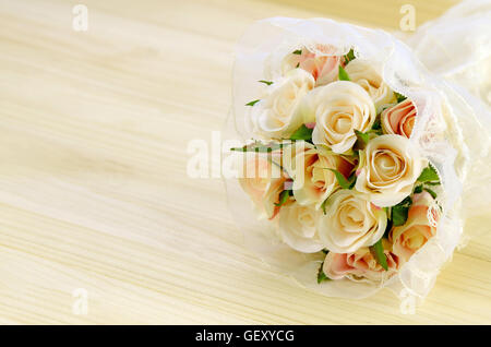 Satin Rose Bouquet on Pine Wood Background. Stock Photo