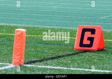 Goal line marker and pylon on football field Stock Photo