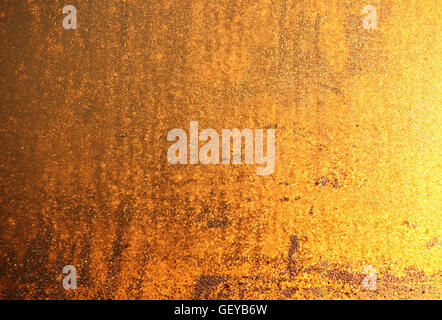 Golden grainy indoor wall background Stock Photo