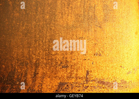 Golden grainy indoor wall background Stock Photo