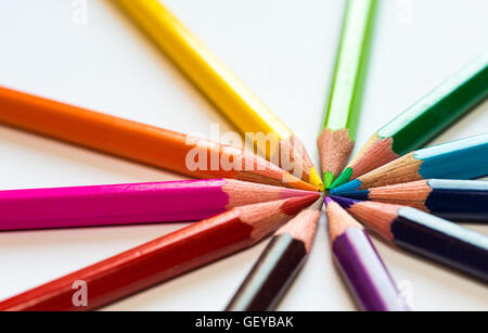 different colored pencils close-up lying on a circle Stock Photo