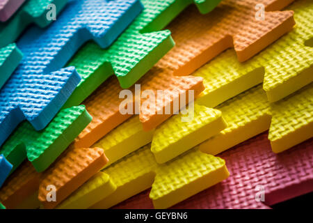 Close up of a joining parts of the colorful pieces of a children's soft toy mat Stock Photo