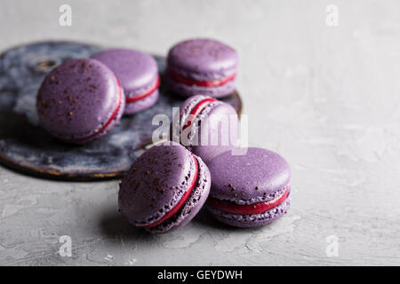 French macarons on a gray table Stock Photo