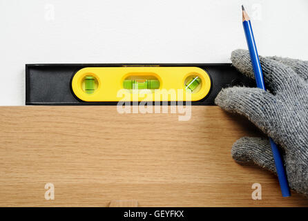 technician using spirit level to checking the level Stock Photo