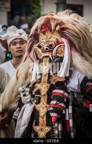 Balinese performer dressed in traditional costume performing ancient ...