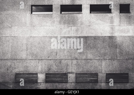 Front View Of Ventilators On Granite Wall Building Facade Stock Photo