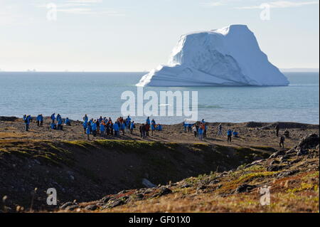 geography / travel, Greenland, Qeqertarsuaq, west coast, tourists in front of an iceberg, Stock Photo