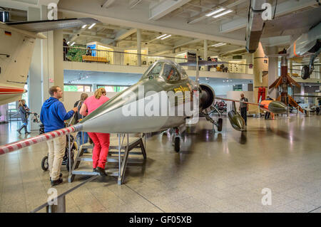 Munich, Germany - May 05, 2015: Modern jet fighter with visitors in Deutsches Museum in Munich. Stock Photo