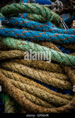 Bunch of different coloured fishing ropes in a harbour Stock Photo