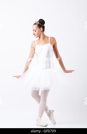 young woman ballerina ballet dancer dancing with tutu in silhouette studio on white background Stock Photo