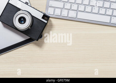 Top view of photo camera lying on the table Stock Photo