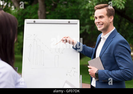 Pleasant smiling man working on the project Stock Photo