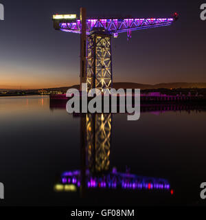 Reflections of the Titan Crane on the River Clyde at Clydebank in Scotland Stock Photo