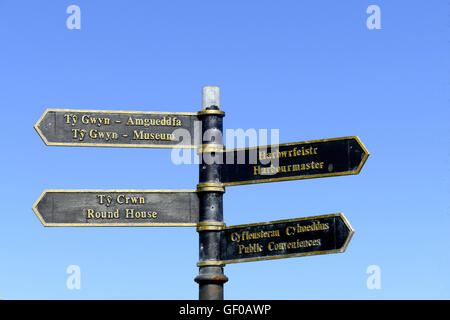 A direction sign giving instructions in Welsh and English. Stock Photo