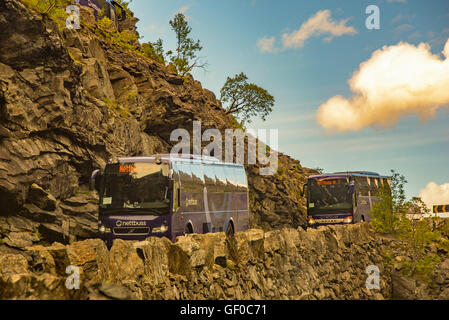 Motorcoach driving on Trollstigen Mountain Road, Reinheimen National Park, Scandanavia, European Stock Photo