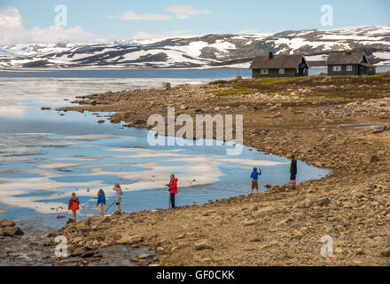 People enjoying Lake Orteren in springtime. Hardangervidda National Park, Norway, Hordaland, Scandinavia, European Stock Photo