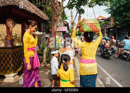 UBUD, INDONESIA - MARCH 2: Balinese family in traditional clothes during the celebration before Nyepi (Balinese Day of Silence) Stock Photo