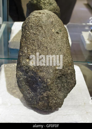 The stone showing the elongated human head can be found in the Paracas history museum Stock Photo