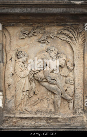 Aeneas flees burning Troy with father Anchises on his shoulder. Renaissance relief on the Summer Palace of Queen Anna in the Royal Garden of Prague Castle in Prague, Czech Republic. Stock Photo