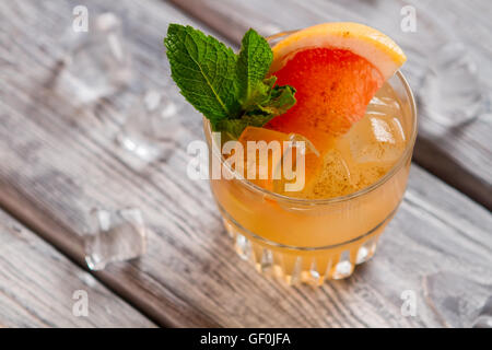 Orange cocktail with ice. Stock Photo