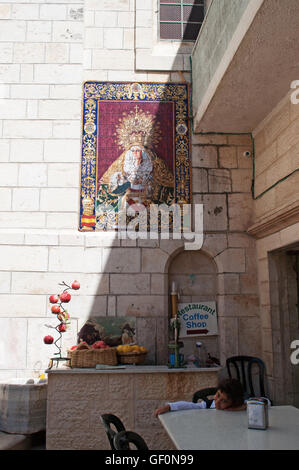 Jerusalem: a baby girl the courtyard of Our Lady of Sorrows Church, an Armenian Catholic Church on the Via Dolorosa Stock Photo
