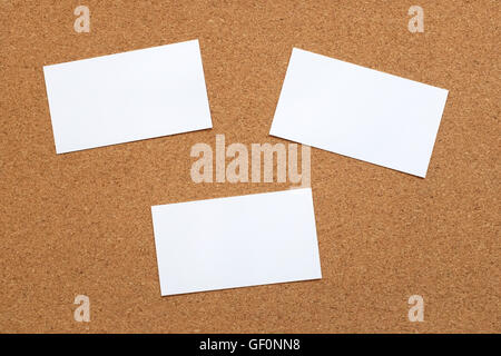 Three blank note cards on a cork memo board background Stock Photo