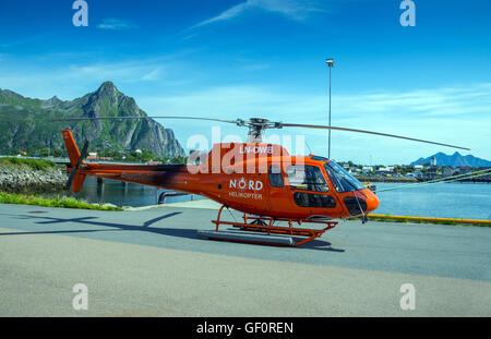 Orange Nord Helikopter, helicopter on harbour harbor side, Svolvaer, Lofoten, Norway Stock Photo