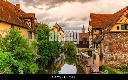 Famous traditional colorful timbered houses in Little Venice, petite Venise and tower of the church, Colmar, Alsace, France Stock Photo