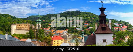 Banska Stiavnica panoramic view with old castle, knocking tower and houses by day, Slovakia