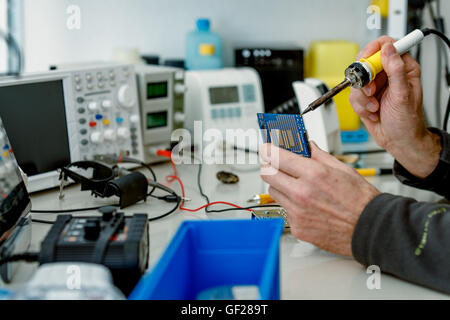 Repair electronic circuit board Stock Photo