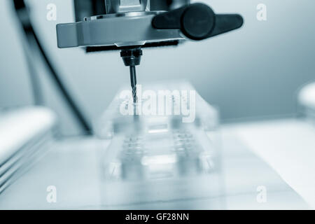 Cutter CNC router and plastic parts of Plexiglas Stock Photo